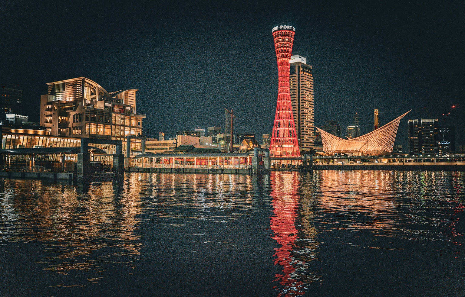 A large body of water with a red tower in the middle of it (Photo by Taisia Karaseva on Unsplash)