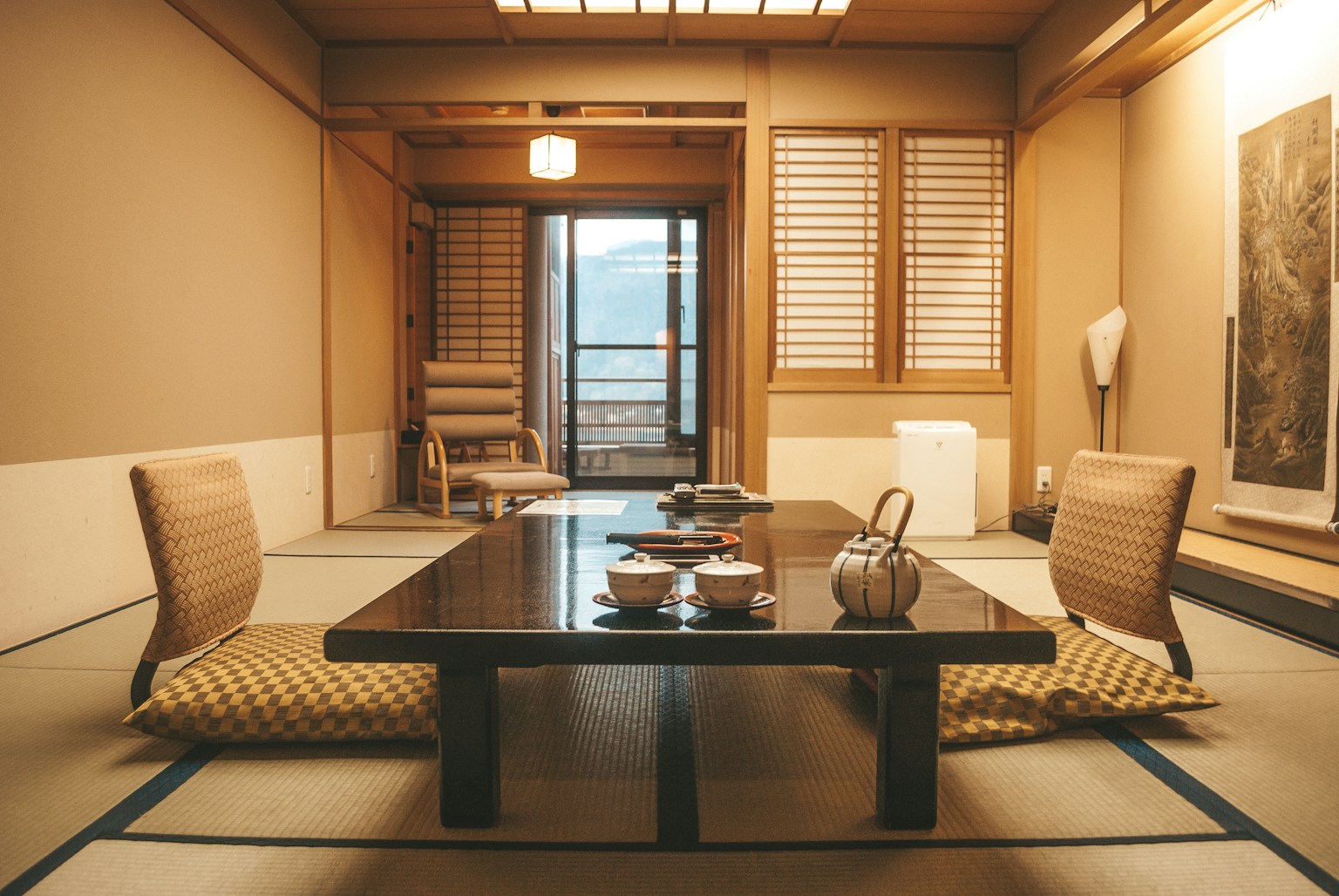 brown wooden table near window (Photo by Filiz Elaerts on Unsplash)