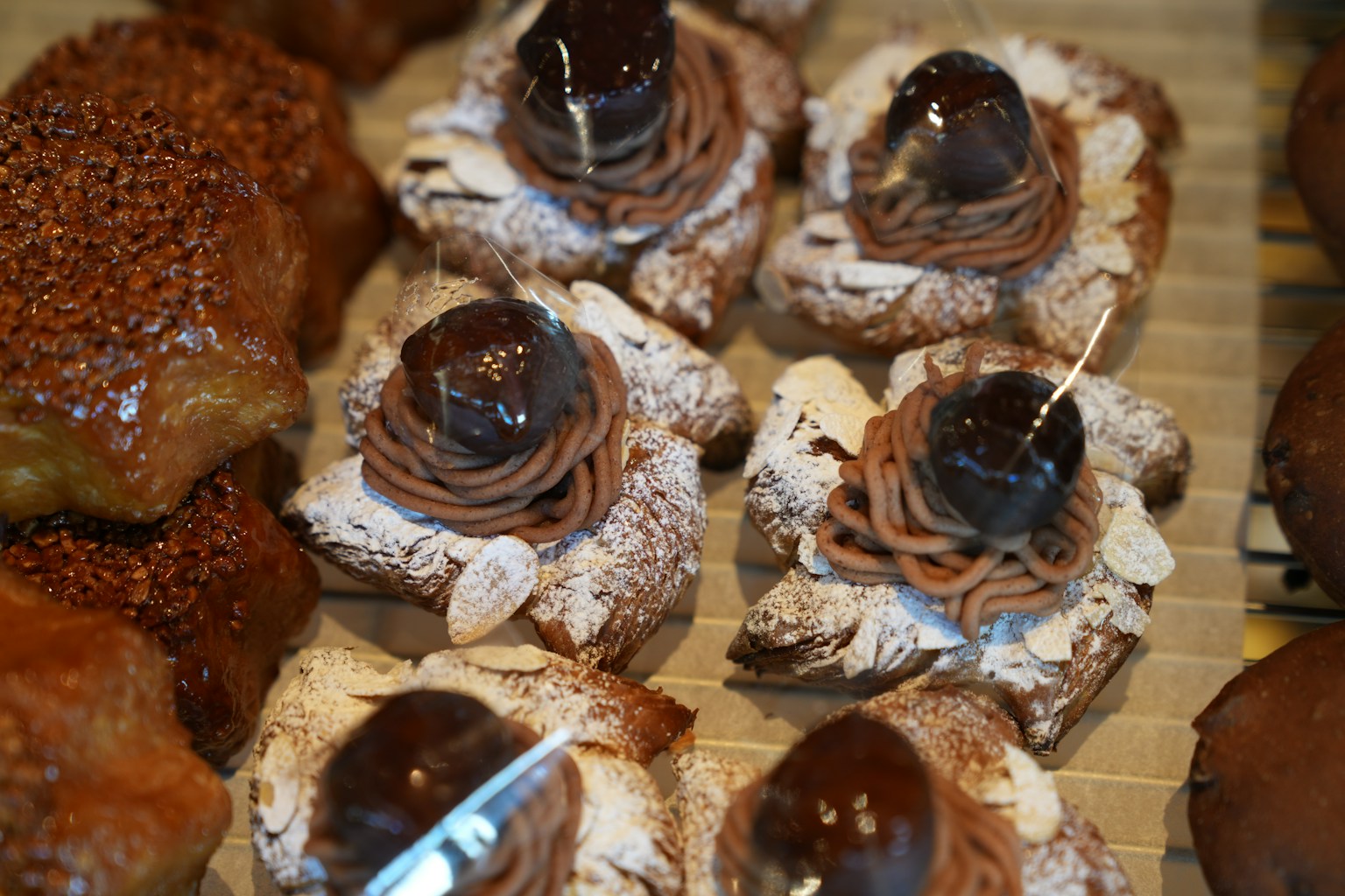 Sweet pastries topped with chocolate and powdered sugar (Photo by Gang Hao on Unsplash)