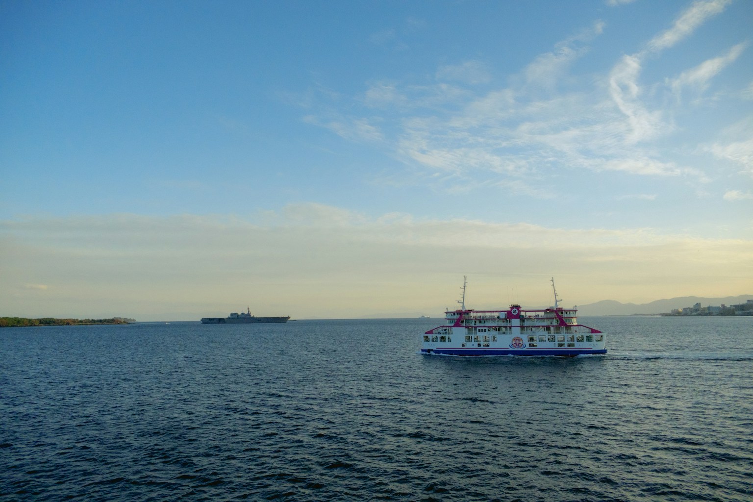 a large boat traveling across a large body of water (Photo by Nichika Sakurai on Unsplash)