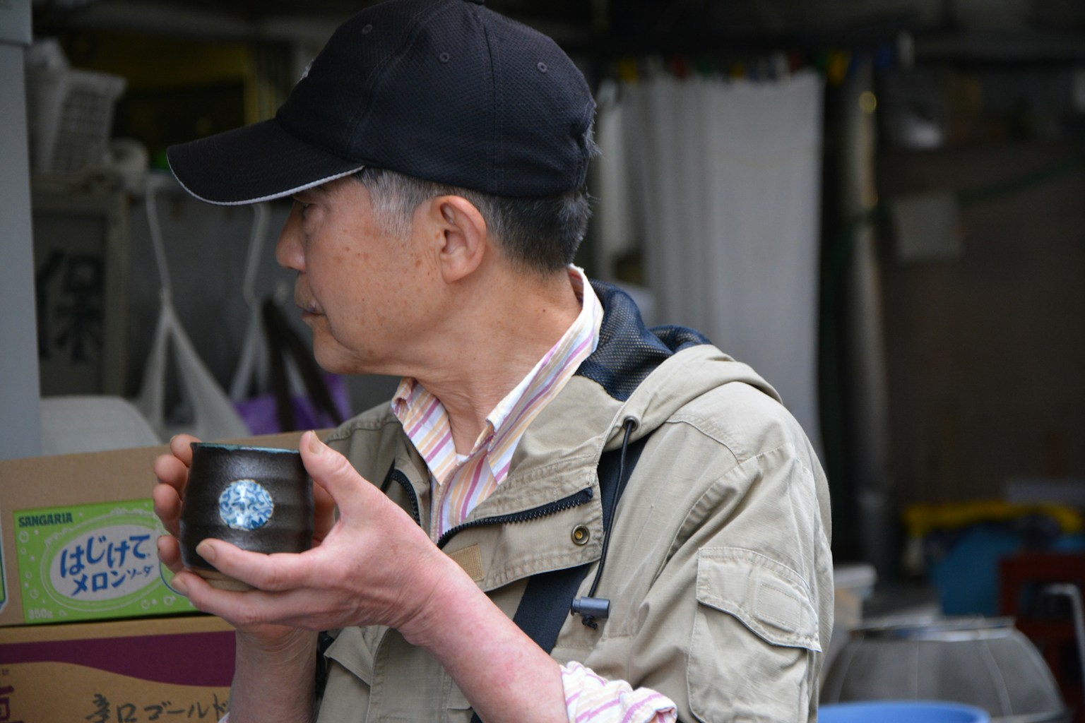 man in black cap and brown jacket holding green can (Photo by Beth Macdonald on Unsplash)