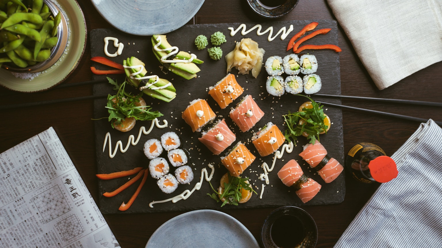sushi on black ceramic plate (Photo by Jakub Dziubak on Unsplash)