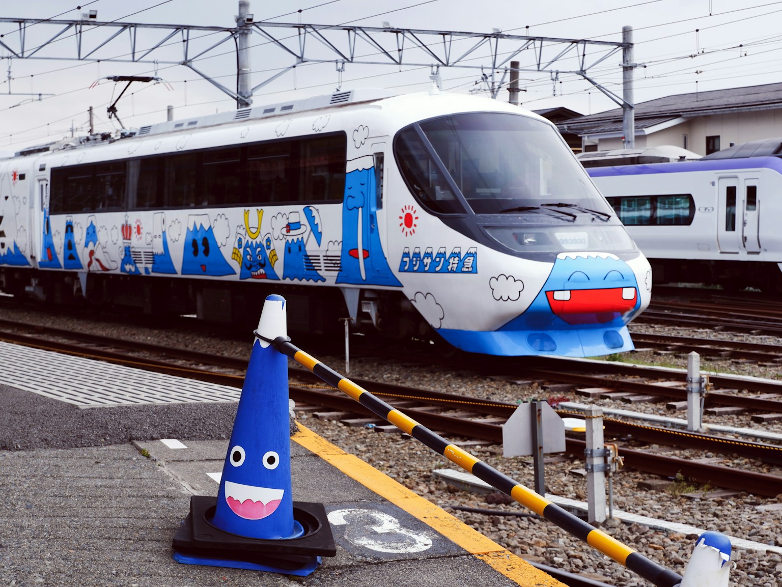 white and blue train on rail tracks (Photo by Susann Schuster on Unsplash)