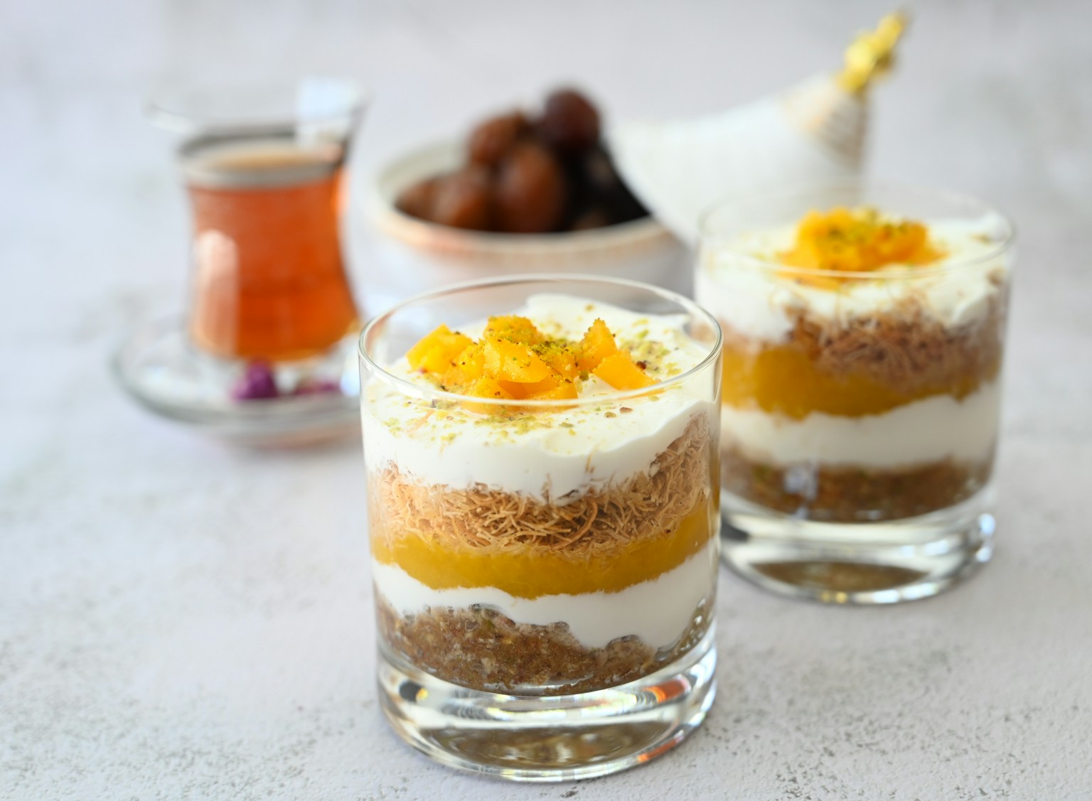 a couple of glasses filled with food on top of a table (Photo by Mohammad Lotfian on Unsplash)