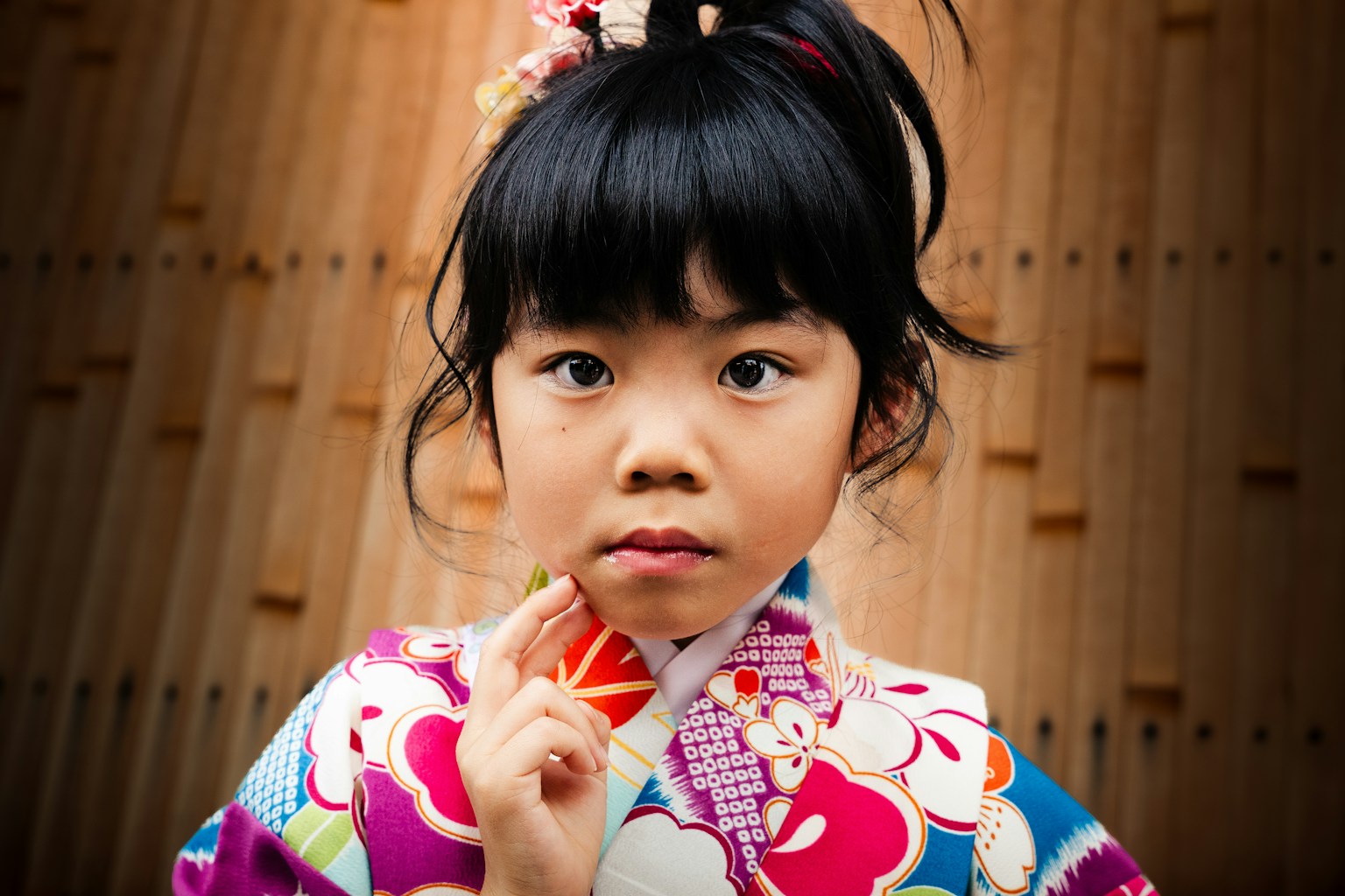a young girl in a kimono poses for a picture (Photo by Brayden Prato on Unsplash)