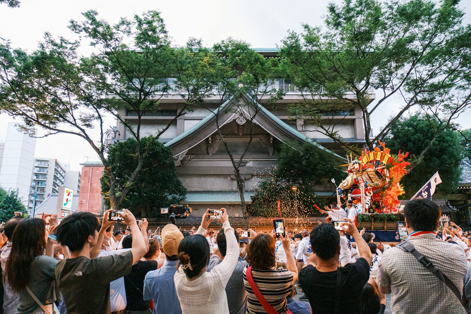 a group of people standing in front of a building (Photo by Nichika Sakurai on Unsplash)