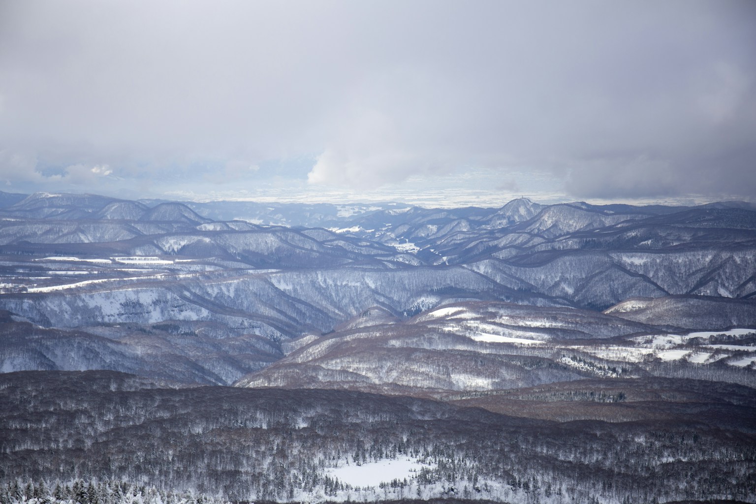 snow covered mountains during daytime (Photo by Sam Lee on Unsplash)